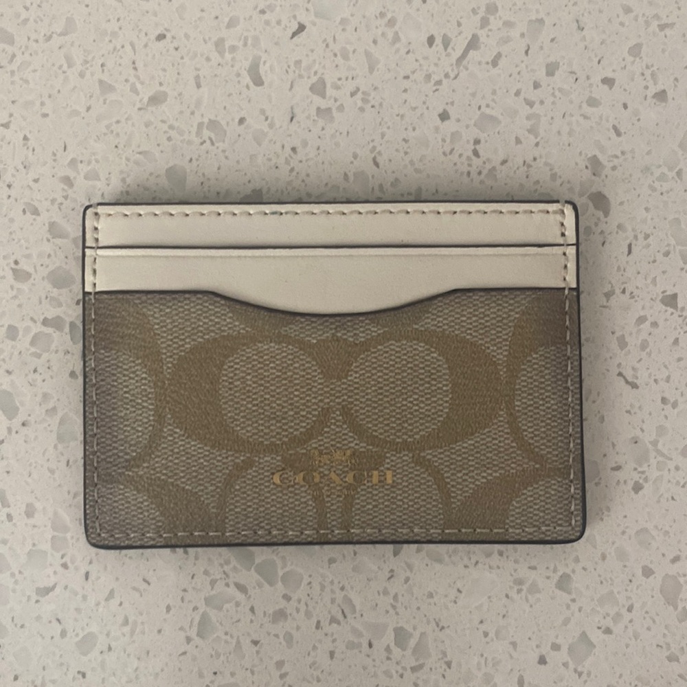 Never used Coach cream and gold mini wallet.